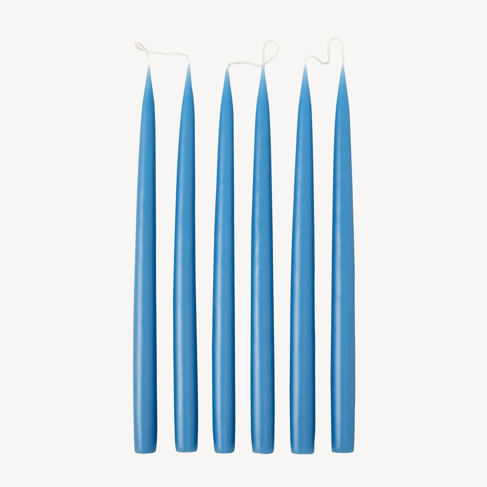 Six Candle Flair taper dinner candles in wedgewood blue stood up in a line