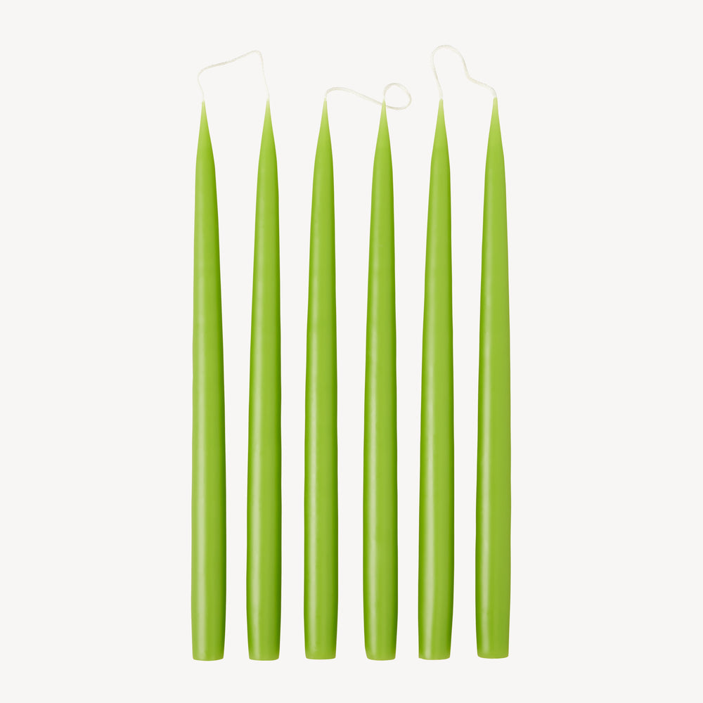 Six Candle Flair taper dinner candles in Spring Green stood up in a line